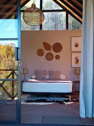 a bedroom with a bed in a room at Cabaña Momotus II in Concepción