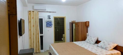 Llit o llits en una habitació de JADO House