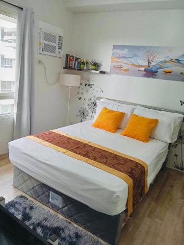 Postel nebo postele na pokoji v ubytování Mesavirre Garden Residences Tower B Studio Unit