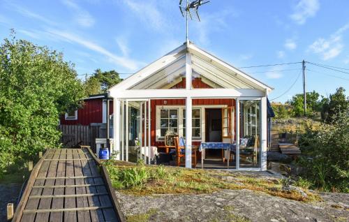 a small house with a white roof at Nice Home In Ronneby With Wifi in Ronneby