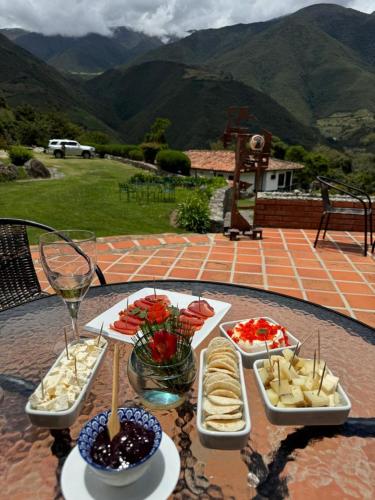 a table with several plates of food on it at Estancia La Cañada in Mérida
