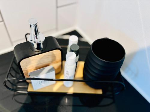 a table with a tray with makeup products on it at BGS Luxury Accommodation-One bed-Cape Town in Cape Town