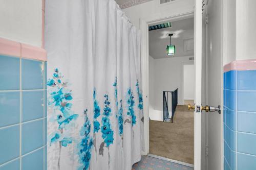 a bathroom with a shower curtain with a christmas tree at Charming Downtown Charleston, Near Hampton Park in Charleston