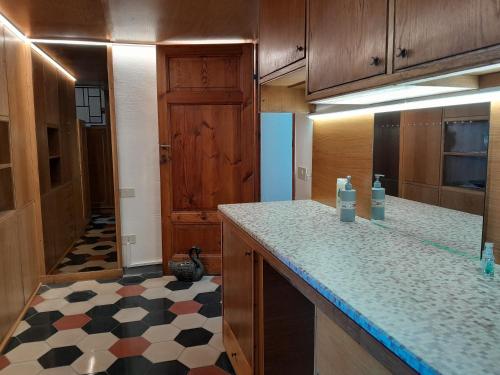 a kitchen with a counter top and a refrigerator at Centro Storico Portoferraio in Portoferraio