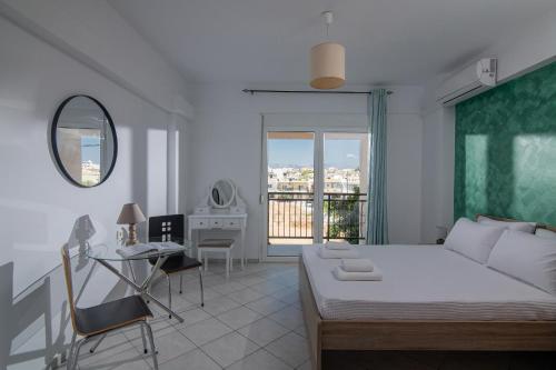 Ένα ή περισσότερα κρεβάτια σε δωμάτιο στο Happy Apartments