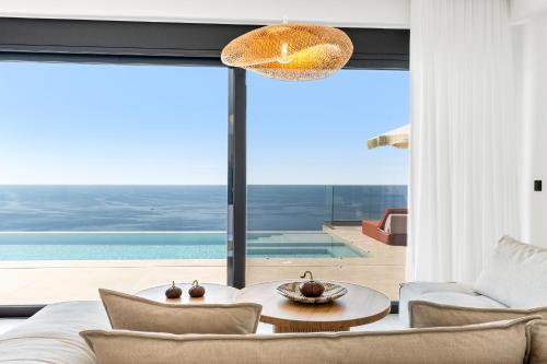a living room with a view of the ocean at Infinity Luxury Villas, Lefkada in Athanion