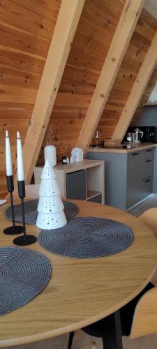 a wooden table in a room with a kitchen at Hill House Žabljak in Žabljak