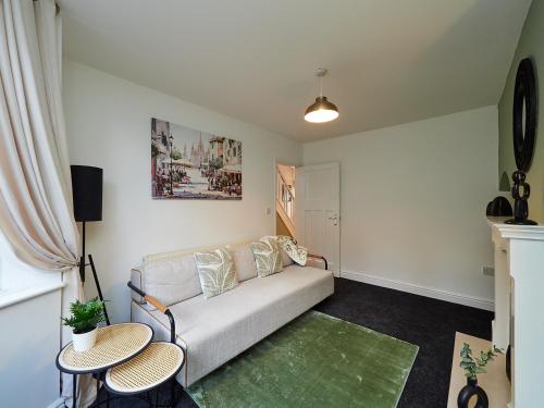 a living room with a couch and two tables at B26-Contractors-HS2-NEC-BHX guests in Birmingham