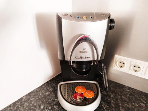 a black and white coffee maker sitting on a counter at Country Residence near Vienna in Stillfried