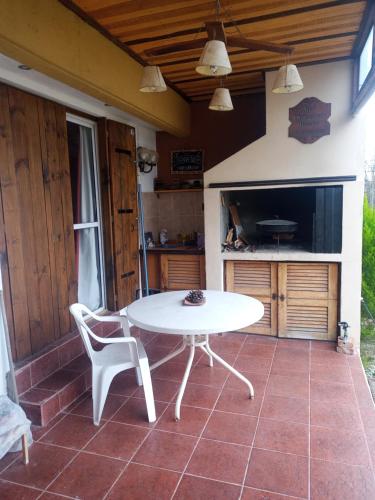a white table and chairs on a patio at Refugio del Alma in San Rafael