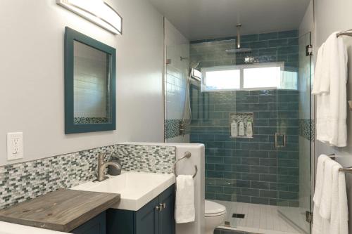 a bathroom with a sink and a shower at Pristine Poway Retreat in Poway