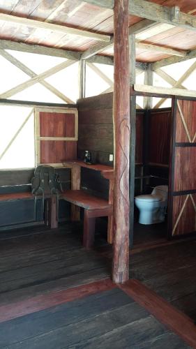 a room with a sink and a toilet in a building at Cabaña Flotante Kurupira in Leticia