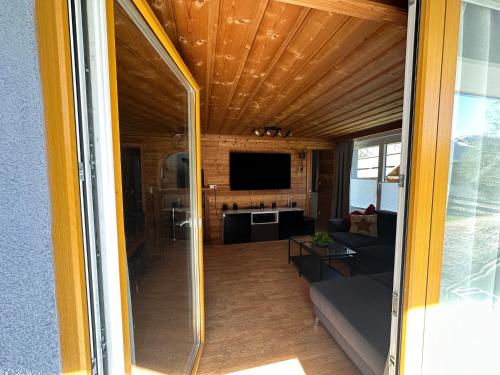 a view of a living room from a sliding glass door at Ferienwohnung Nockberge in Staudach