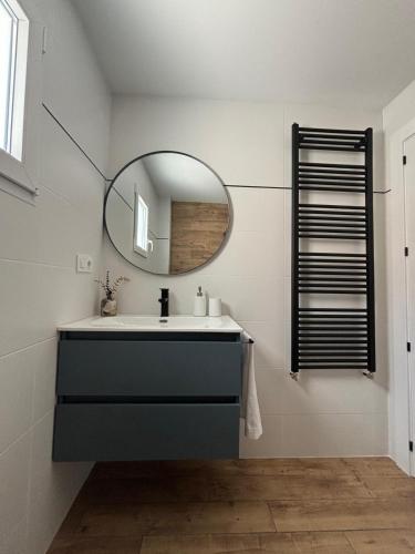 a bathroom with a sink and a mirror at Gaude - Apartamento de diseño con Patio - in Albacete