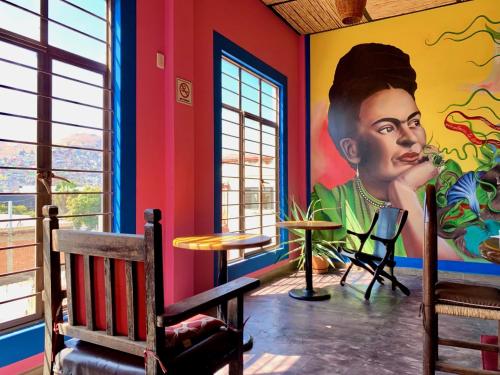 a room with a painting on the wall at Diaza Rooms Center of Oaxaca in Oaxaca City