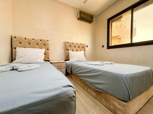 Postel nebo postele na pokoji v ubytování appartment igar azougagh elhoceima