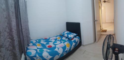 a room with a couch in the corner of a room at Santai Homestay 2 in Kota Kinabalu