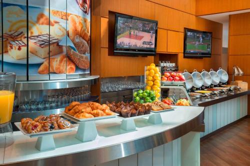 a buffet line with different types of food on display at Marriott Downtown at CF Toronto Eaton Centre in Toronto