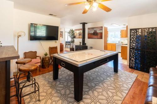 a living room with a ping pong table in it at Stylish Country Cowboy Home with Hot Tub on 20 Acres in Borrego Springs