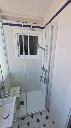 a bathroom with a shower and a toilet and a sink at Ardhraubu Villa, Terra Cotta & Very Close to Sea in La Cala de Mijas