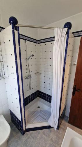 a bathroom with a shower and a toilet at Ardhraubu Villa, Terra Cotta & Very Close to Sea in La Cala de Mijas