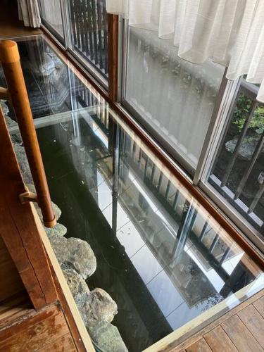 an inside view of a window with a pool of water at おれっちのひみつきち2 in Yaizu