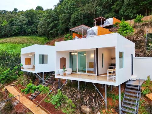 an aerial view of a house on a hill at มิด้าโฮมสเตย์ม่อนแจ่ม in Mon Jam