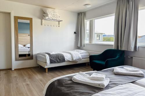 Postel nebo postele na pokoji v ubytování Hotel Jökull
