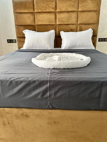 Postel nebo postele na pokoji v ubytování appartment igar azougagh elhoceima