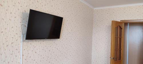 Μια τηλεόραση ή/και κέντρο ψυχαγωγίας στο Nord bus Station Lux Apartament