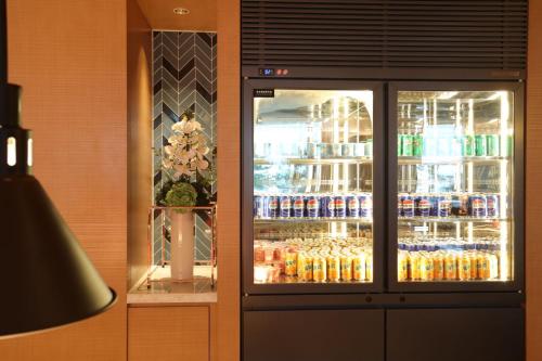 a refrigerator filled with lots of drinks in a store at Fairfield by Marriott Yantai in Yantai