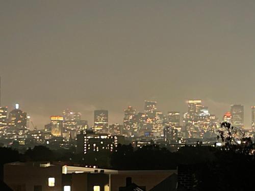 a view of a city skyline at night at Amazing Boston Downtown City View Rooms in Boston