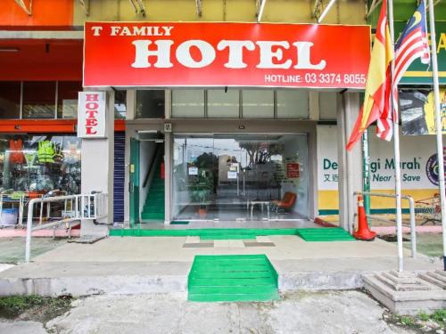 a hotel with a red sign on the front of it at Hotel Rim Global, Klang in Kampong Pandan