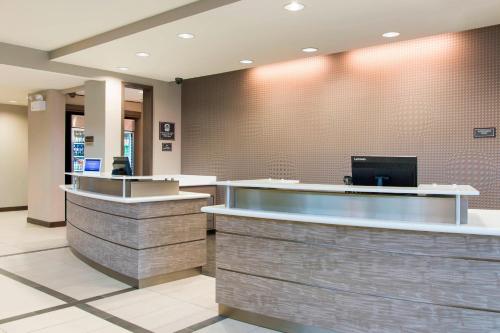 a lobby of a hospital with a reception counter at Residence Inn by Marriott Milwaukee West in Wauwatosa