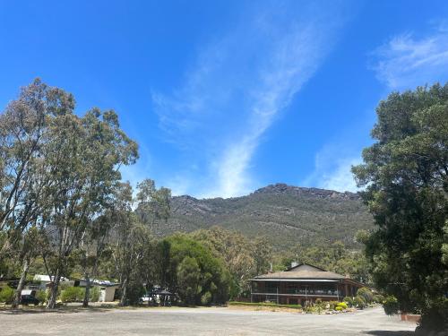 a view of a mountain from a parking lot at Golden Chain Country Plaza Motel Halls Gap in Halls Gap