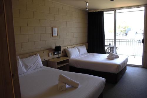 Ένα ή περισσότερα κρεβάτια σε δωμάτιο στο Bendigo Motor Inn