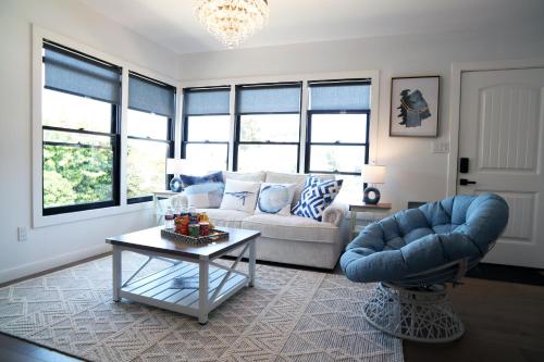 a living room with a couch and a table at La Jolla Beach Villa Gem in San Diego