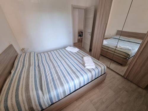 Postel nebo postele na pokoji v ubytování Relax Rosolina Mare