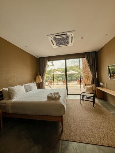 Katil atau katil-katil dalam bilik di Historykan Kanchanaburi Hotel