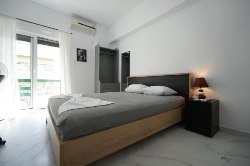 Ένα ή περισσότερα κρεβάτια σε δωμάτιο στο Couples Cozy Seaside Studio