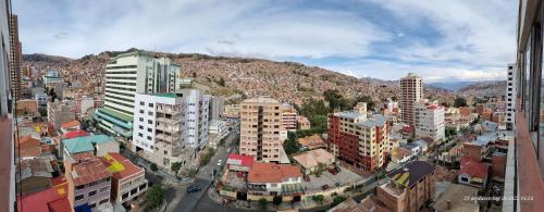 an aerial view of a city with tall buildings at Miraflores departamento céntrico, amplio, hermosas vistas, dúplex 3 dormitorios in Chijini