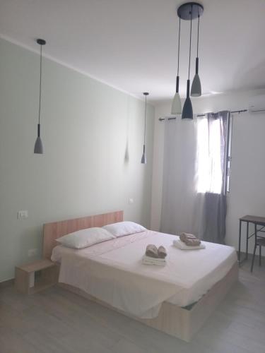 Postel nebo postele na pokoji v ubytování bayekou trapani