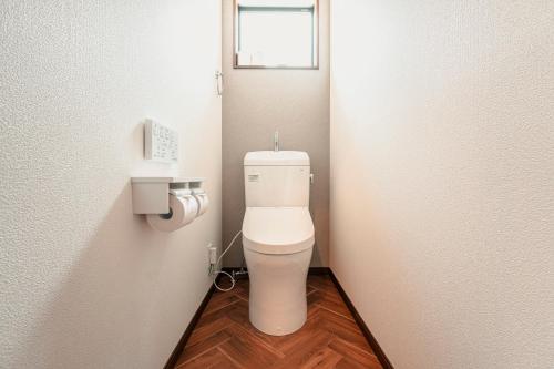 a small bathroom with a toilet in a stall at VILLA KAWAZU - Mori - in Shimo-sagano