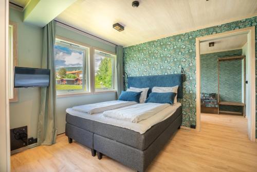 Ένα ή περισσότερα κρεβάτια σε δωμάτιο στο Lillehammer Turistsenter Budget Hotel
