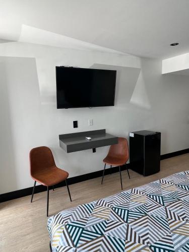 Televisyen dan/atau pusat hiburan di Arlo Motel