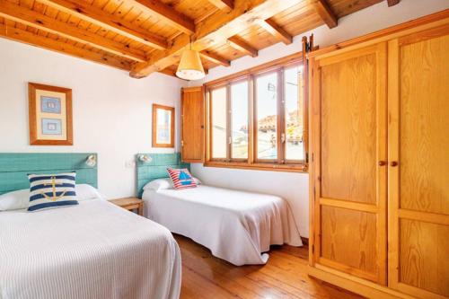 Posteľ alebo postele v izbe v ubytovaní Casa marinera céntrica en Comillas
