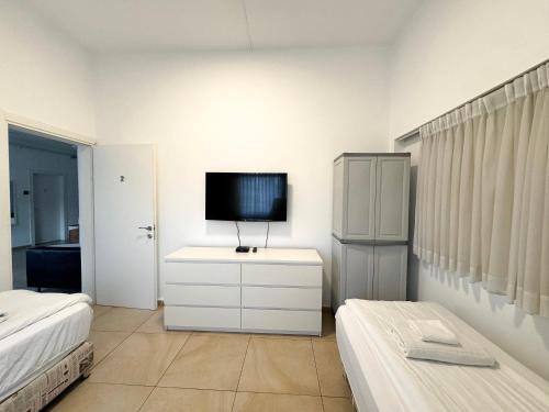 Cama o camas de una habitación en Begin19 Apartments & Hostel