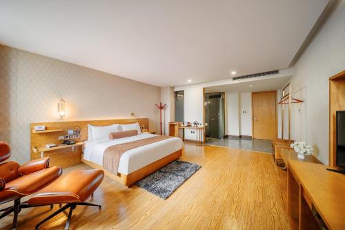 Postel nebo postele na pokoji v ubytování Cosy Feeling Hotel - Beijing Headquarters Xinfadi