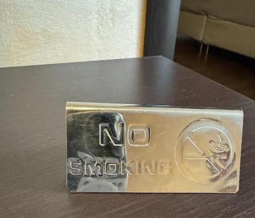a metal box with the words no smoking on it at Bansko Royal Towers Thea Apartment in Bansko