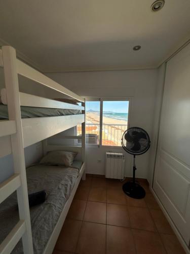 Ένα ή περισσότερα κρεβάτια σε δωμάτιο στο Moya Apartment Denia - Seaview Apartment